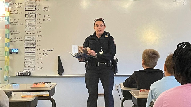 K-8 School in Grands Rapids: GRPD Officer speaks to students at Excel during Safe Schools week.