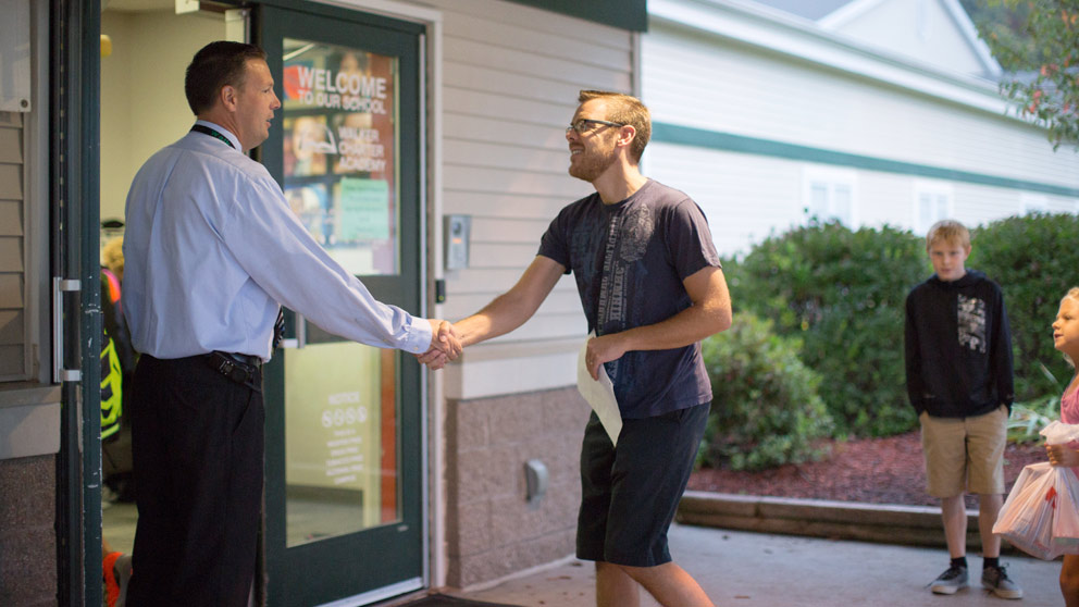 Parent picking up student from class