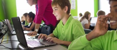 Students completing work in classroom