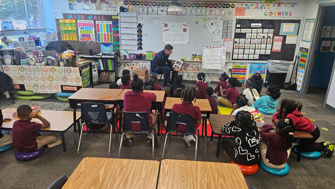 K-8 School in Warren: Warren Fire Dept. reads to Great Oaks students during Safe Schools Week.