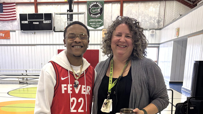 K-8 School in Ypsilanti: Rapper KidJay poses with Fortis principal, Erin Dixon.