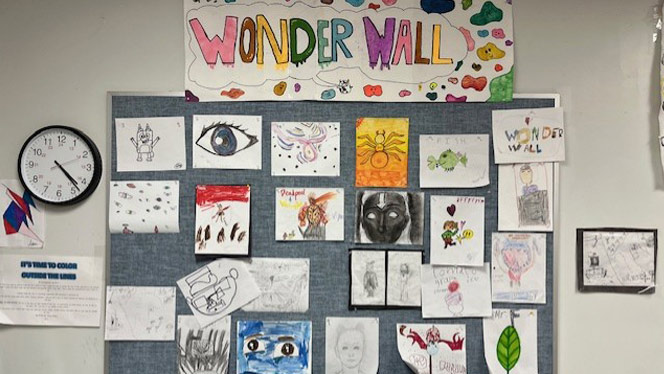 K-8 School in Apex: Wonder Wall of student art work from John Fountain's art class.