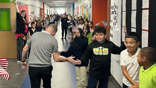 K-8 School in Watkins: Sky Ranch students held special Veterans Day walk.