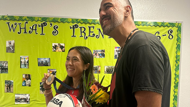 K-8 School in Grand Rapids: Alena Olsen and Ridge Park PE Teacher Mercado take a photo.