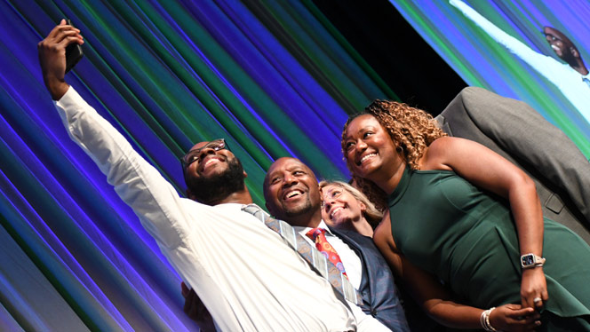 National Heritage Academies: Westfield Prep leaders take a selfie on stage after winning an Eagle Award.