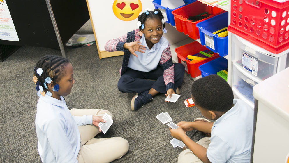 Teacher helping student