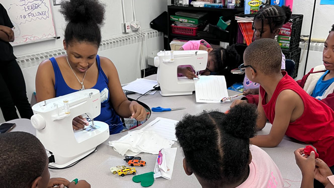 K-8 School in Detroit MI: Detroit Merit students learn to sew.