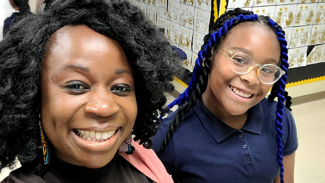 K-12 School in High Point: Phoenix Academy teacher, Johnson, with student.