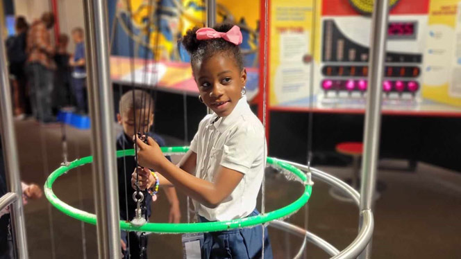 K-8 School in Detroit: Detroit Premier lower elementary student uses bubble machine.