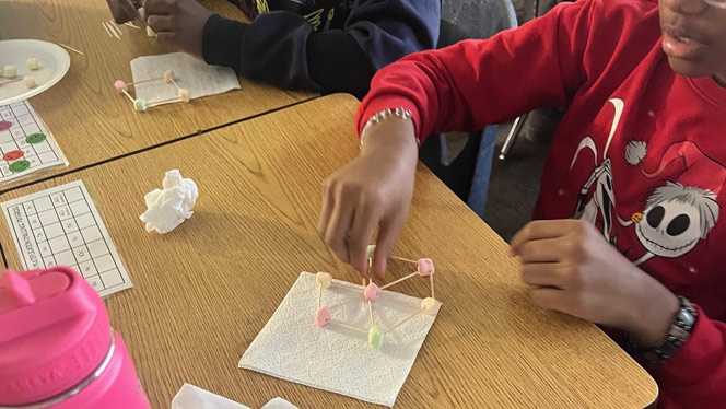 K-8 School in Detroit: Detroit Merit student works on their snowflake design.