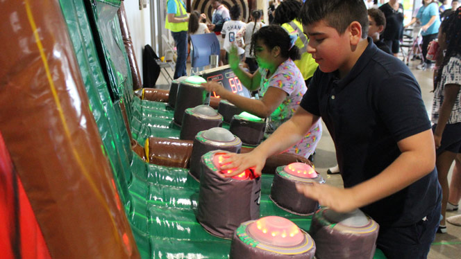 K-12 School in Waterford: Students participating in game at event.