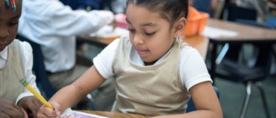 Brooklyn Excelsior Charter School, K-8 School in Brooklyn, NY: two girls working on a drawing in class.