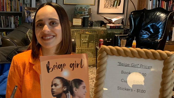 K-8 School in Flint MI: Cooley poses with her book "Beige Girl."