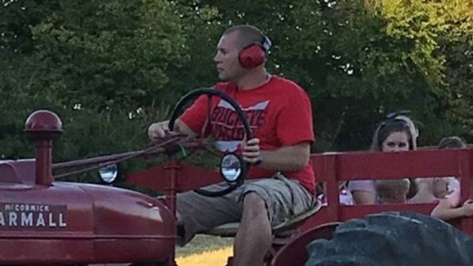 K-8 School in Dayton: Trussel driving a tractor at Great Life Farms.