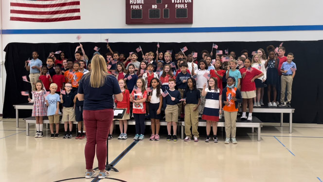 K-8 School in Mint Hill: Queen's Grant fourth grade students singing the song "Thank You Military."