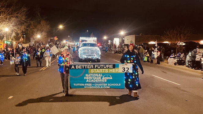 K-8 School in Brighton: Landmark and Foundations Admissions Managers walk the NHA banner in the parade.