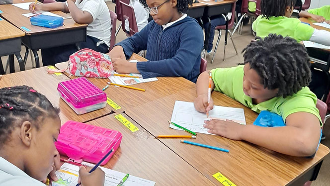 K-8 School in Detroit: Flagship students work on assignment in Ms. Jackson-Clayborn's class.