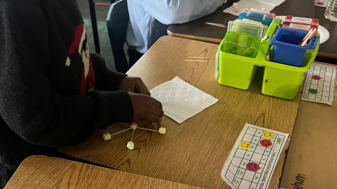 K-8 School in Detroit: Detroit Merit student works on their snowflake design.