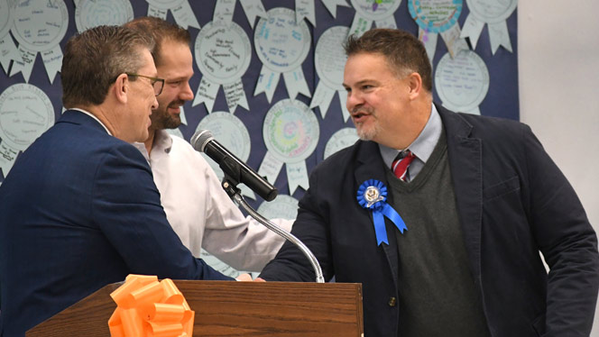 K-8 School in Belmont: Chandler Woods Principal Hardenburgh shakes State Senator and State Representatives hands.