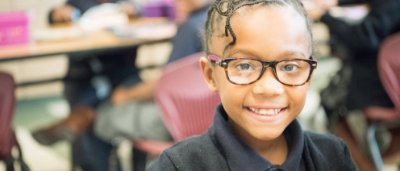 Student smiling in classroom