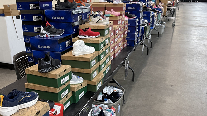 Charter Schools in Grand Rapids: National Heritage Academies partnered with In The Image Shoes Event to provide a pair of shoes to students.