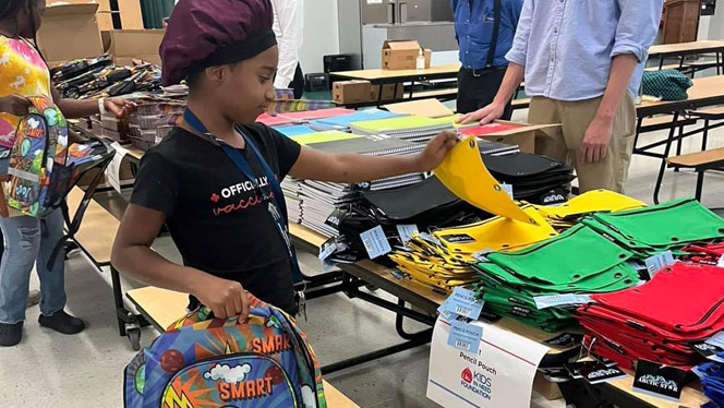 K-8 School in Buffalo NY: Student picks out a pencil pouch during the event.