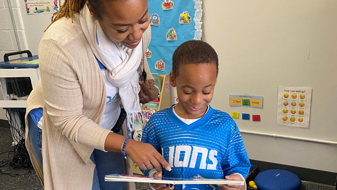 K-6 School in Redford Charter Twp.: Dean Laster-Bey works with Westfield Charter student.