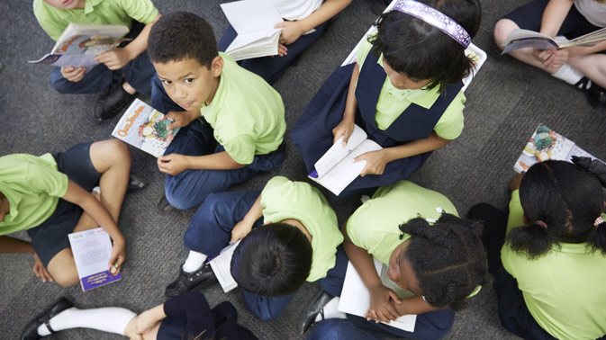 Teacher helping student
