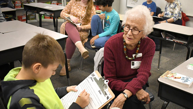 K-8 School in Wyoming: Residents of Waterford Place visit Vanguard every two weeks to help students with reading.