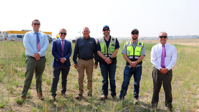 New K-6 School in Commerce City CO: Board members and construction crew posing for photo.