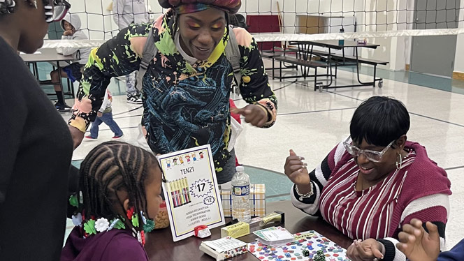 K-8 School in Romulus: Students and parents play board games together at Metro Charter Academy's game night.