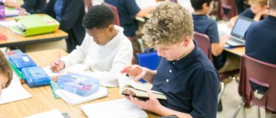 Students completing work in classroom