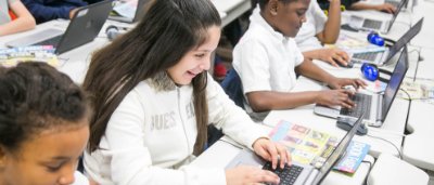 Students completing work in classroom
