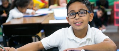 Student smiling in classroom
