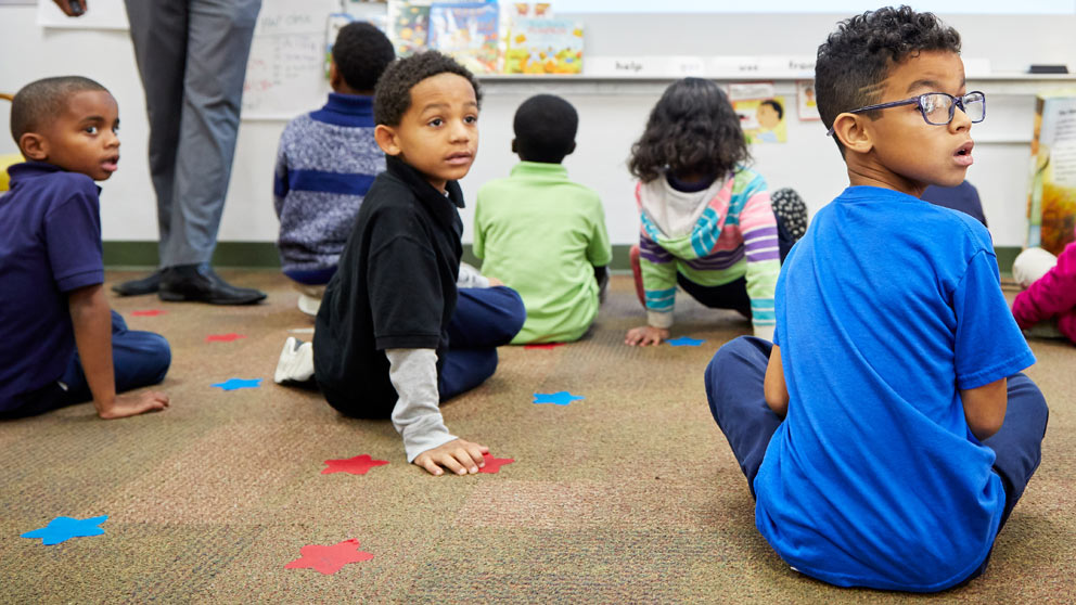 Teacher helping student