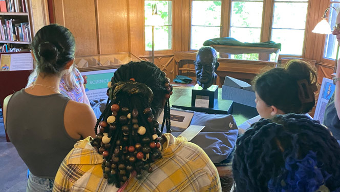 Charter School in Grand Rapids: Oxford Scholars view the oldest surviving fragment of Mathew's gospel at Magdalen College.