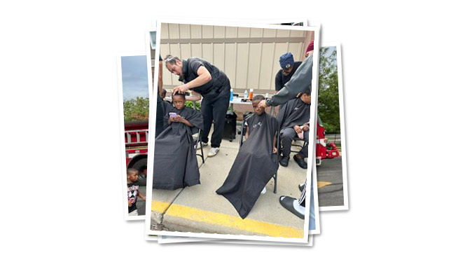 K-8 School in Milwaukee WI: Students get haircuts at the back to school bash event.