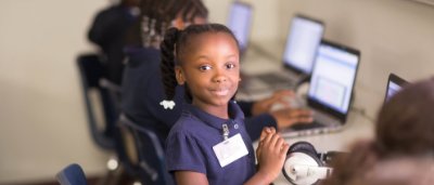 Student smiling in classroom