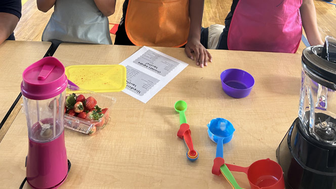 K-8 School in East Cleveland: Apex Academy students measuring ingredients for a smoothie.