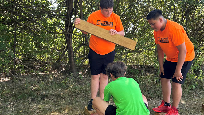 K-8 School in Dayton: Pathway students participating in team building activity at Great Life Farms.