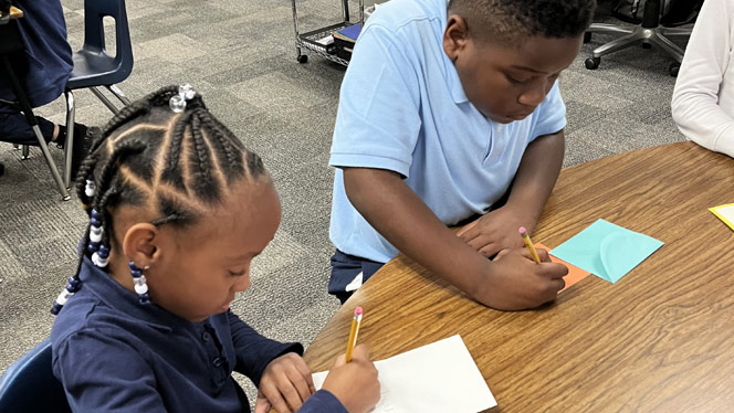 K-8 School in Mint Hill: Queen's Grant students write cards to Hurricane Helene victims.