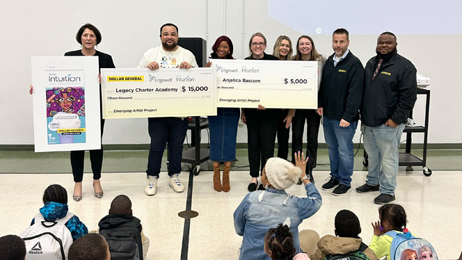 K-8 School in Detroit: Legacy Principal Nathan Tomlinson and Art Teacher Anjelica Bascom pose with officials from Dollar General, celebrating Bascom’s accomplishment.