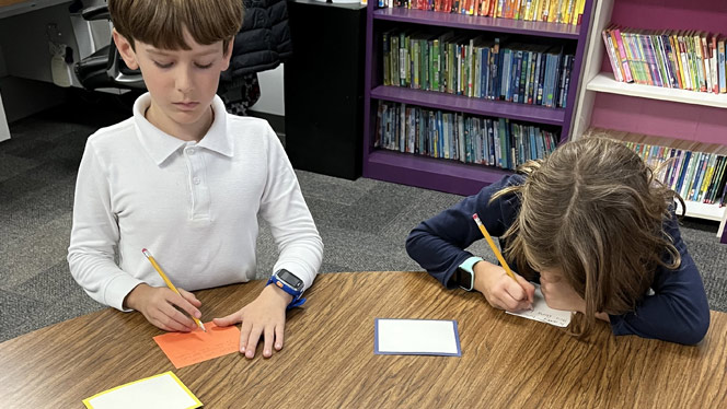 K-8 School in Mint Hill: Queen's Grant students write cards to Hurricane Helene victims.