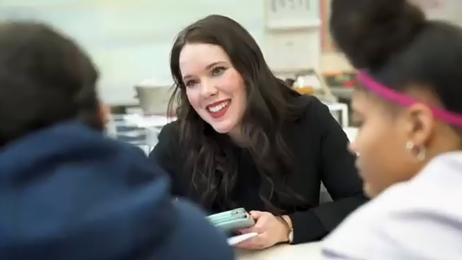 K-8 School in Warren: Great Oaks teacher Ms. Haynes helps her students.