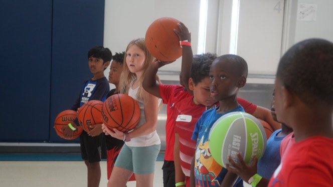 K-8 School in Canton: South Canton students participate in basketball station.