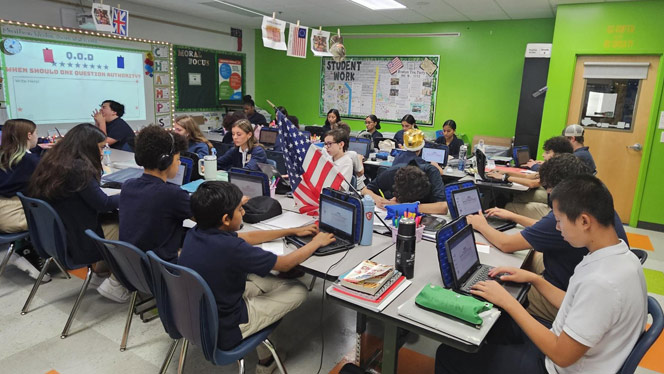 K-8 School in Wake Forest: Students in Williams’ class learn about the American Revolution while their artifacts are hung across the room.