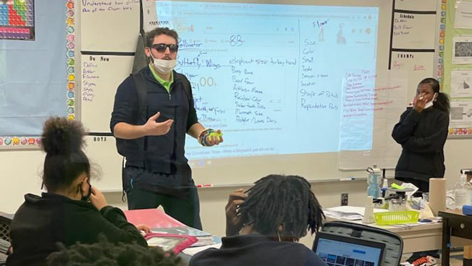 K-8 School in Syracuse: Welsh, math teacher at Southside, teaches a lesson in front of the class.