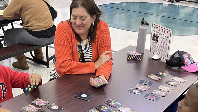 K-8 School in Romulus: Students and parents play board games together at Metro Charter Academy's game night.