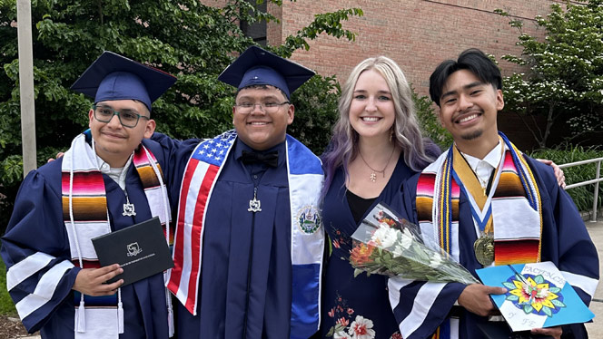 High School in Kentwood MI: Grand River Prep school counselor Schumacher-Smith takes photos with high school graduates.