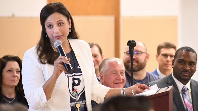 K-8 School in Detroit: Pembroke Principal speaking during a school-wide assembly.